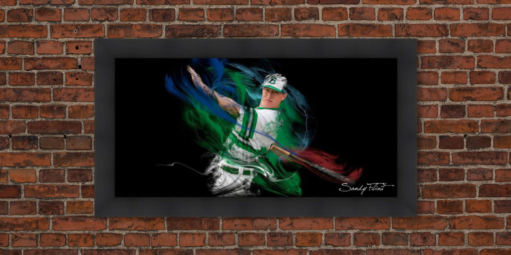senior portrait of baseball player hanging on a brick wall by Houston senior photographer Sandy Flint | Flint Photography