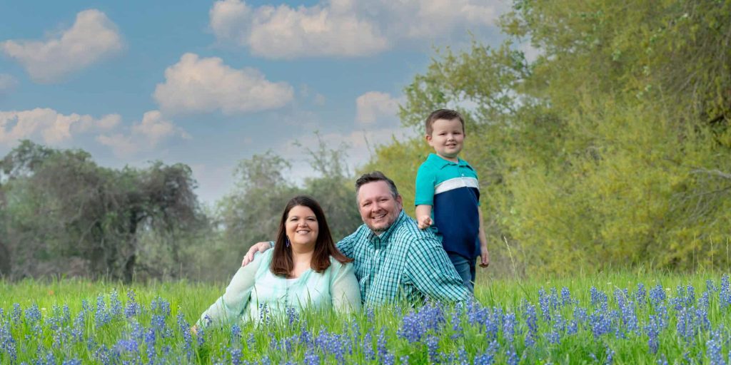 Family portrait created in a field of Texas Bluebonnets - Brenham, Texas