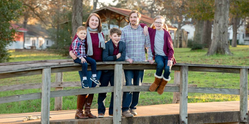 Family portrait on a wooden bridge near Round Top, Texas
