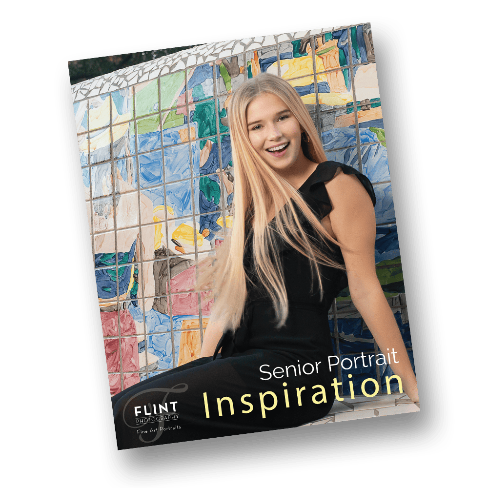 Fashion-inspired high school senior portrait of a young woman seated on a colorful mosaic tile bench in a city setting.